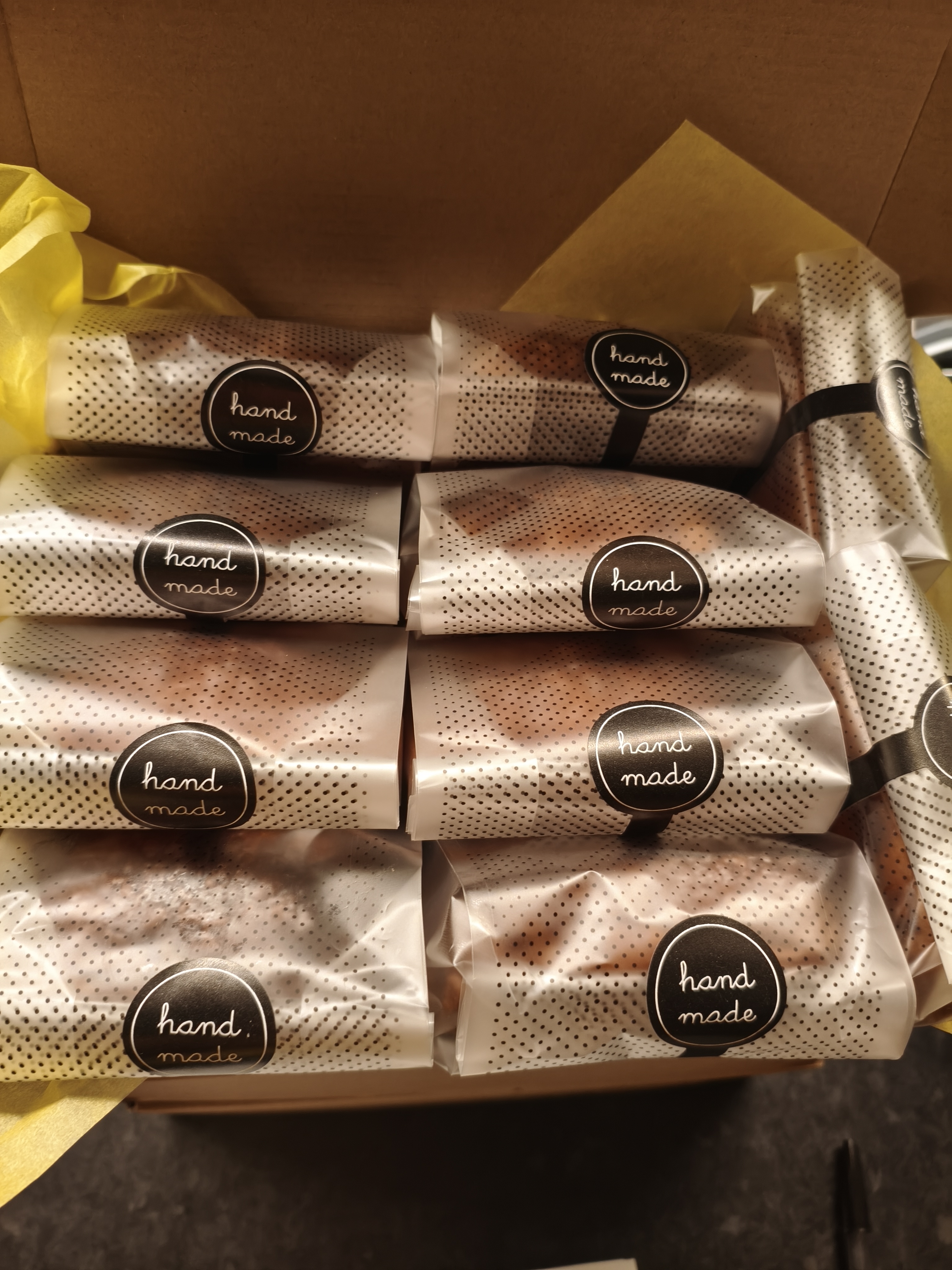 Box of individually wrapped Pain au Chocolat with hand-made seals